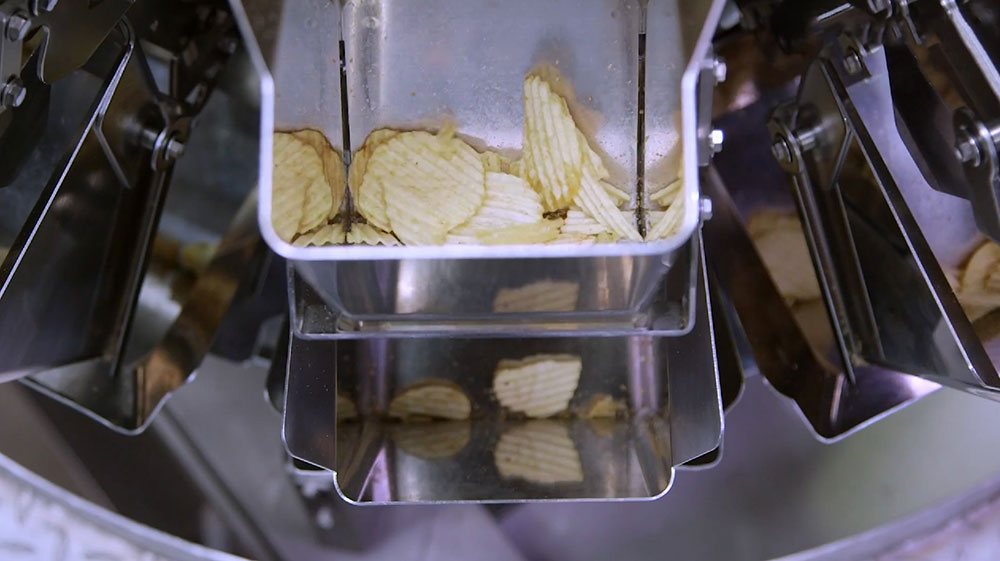 Automated weighing of snack foods and potato chips